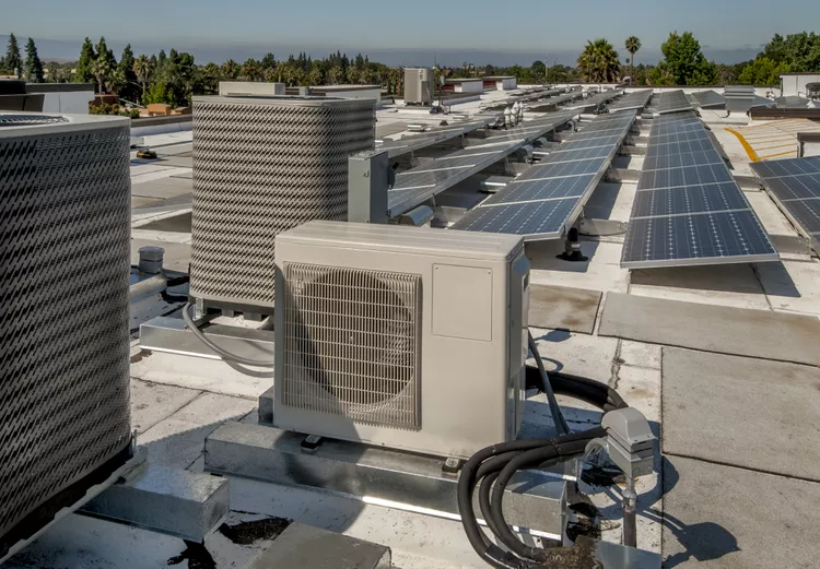 rooftop-hvac-installation-with-solar-panels-489904512-dbde611888dd4982ac3fa055d245e5a0